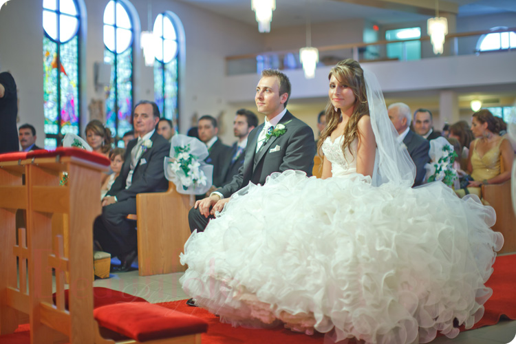 Italian Bride and groom sitting in church