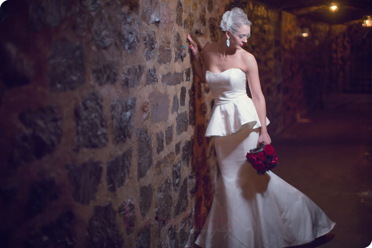 Montreal wedding photographer-beautifoto-the Bride posing next to a stone wall at club Velvet at Auberge st-Gabriel at the Old Port in Montreal
