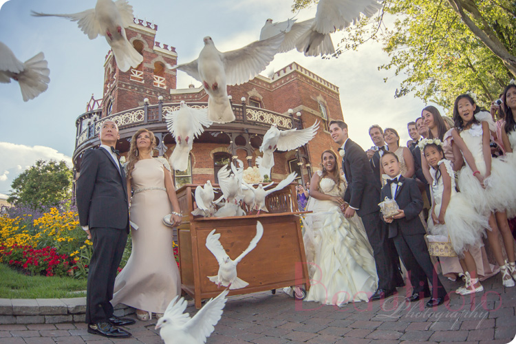 the bride and groom release the doves at their ceremony at Chateau st-Antoine