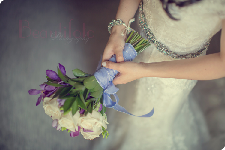 the bride holding her wedding flower bouquet