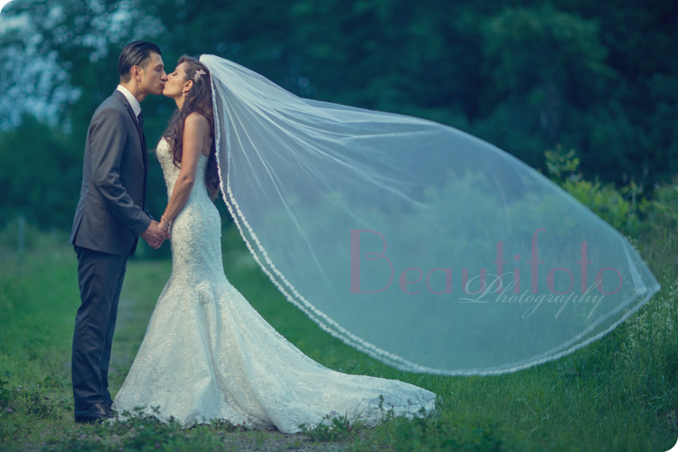 Artistic portrait of the bride and groom by Beautifoto